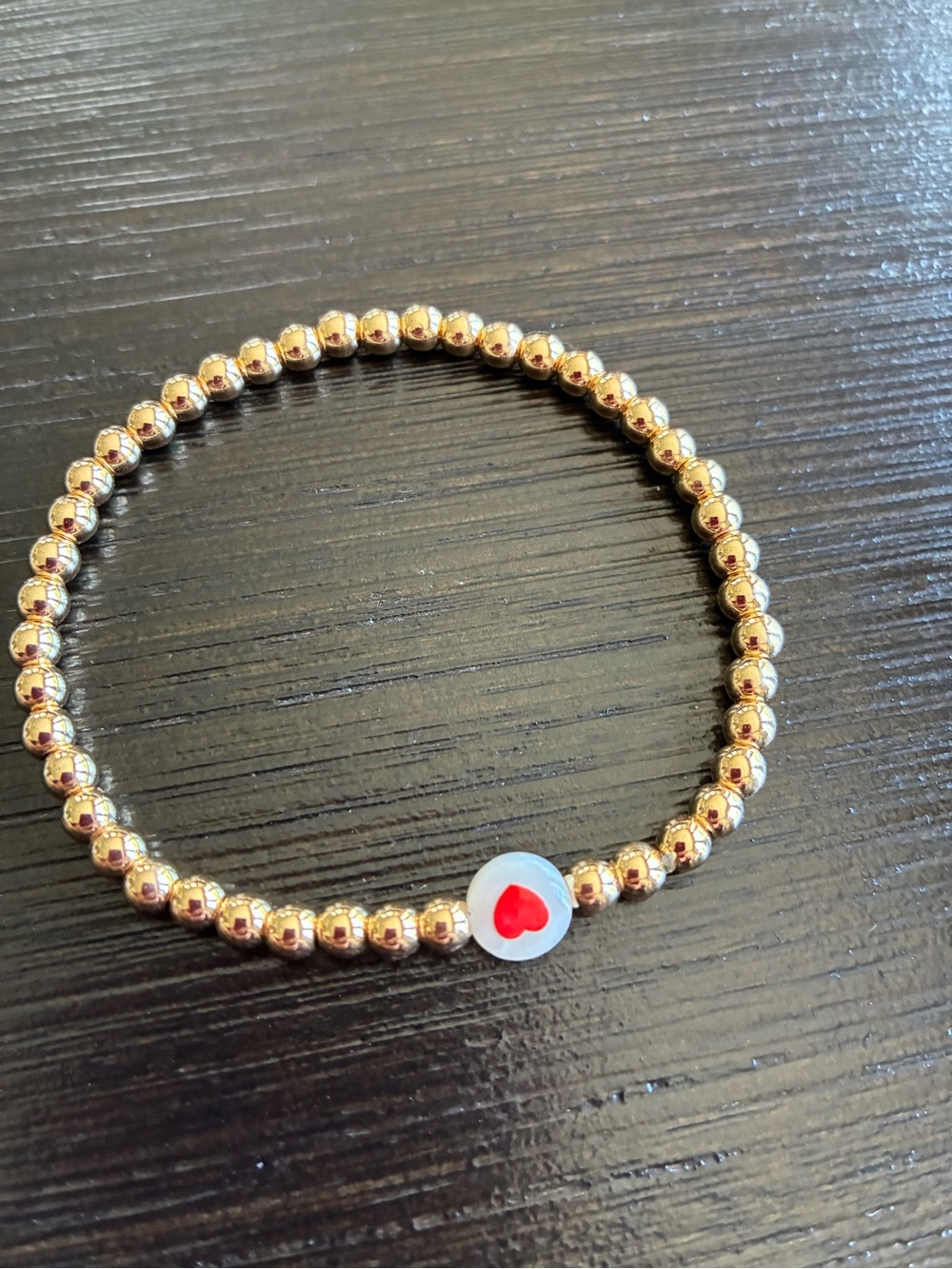Gold Beaded Stretch Bracelet with Red Heart Accent